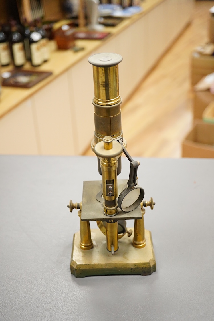 A mid 19th century French brass monocular microscope, 26cm high